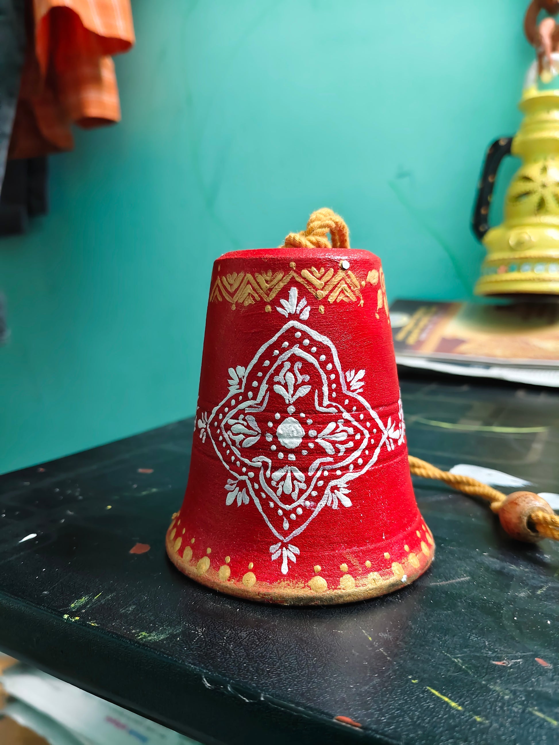 “Crimson Kolam Charm” Handpainted Terracotta Hanging Décor